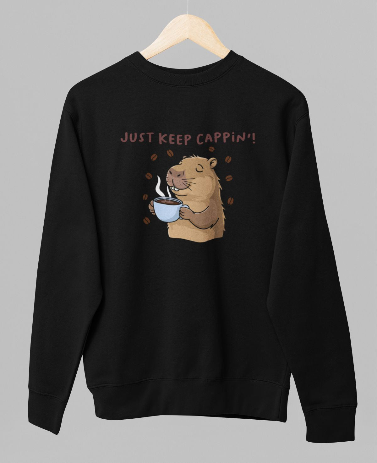 Juodas UNISEX džemperis be gobtuvo "Just keep cappin'"