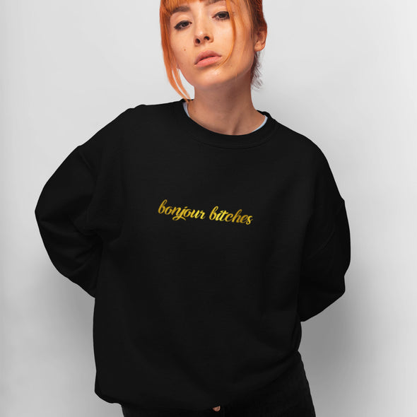Juodas UNISEX džemperis be gobtuvo su blizgiu auksiniu marginimu "Bonjour bitches"