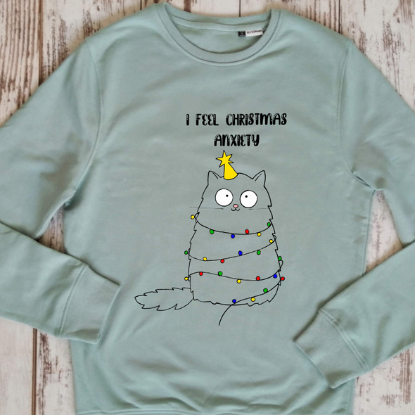 Švelniai žalias organinės medvilnės UNISEX džemperis be gobtuvo "Christmas anxiety"